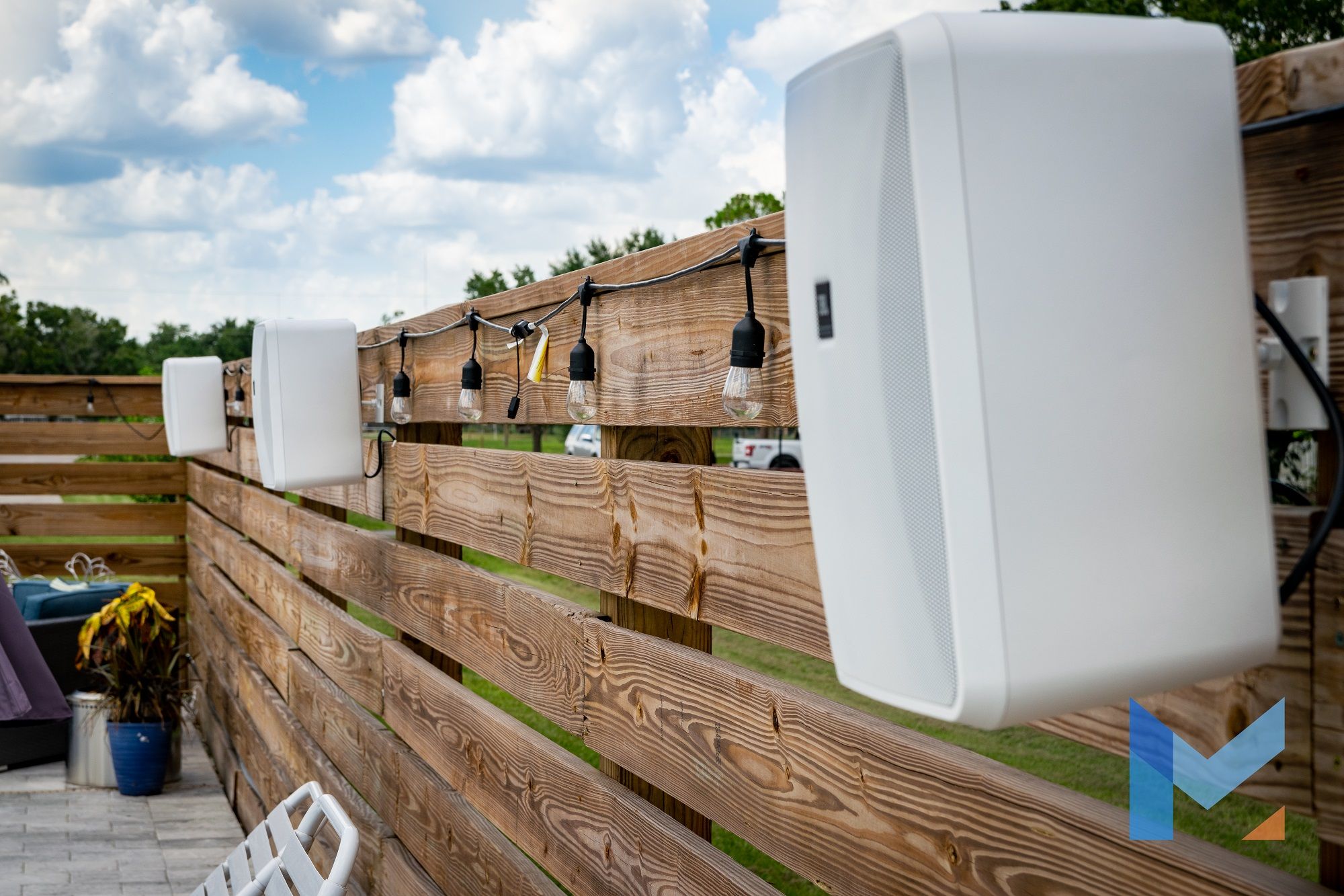 Large white outdoor audio speakers