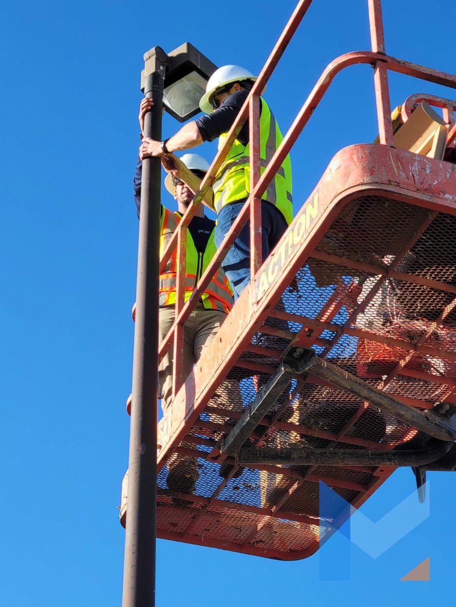 Modern Tek Solutions workers on lift